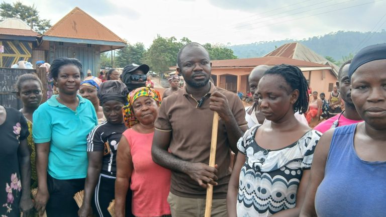 Juaboso DCE, Hon. Alexander Adu-Quist, joins residents of Asempaneye, Breman for National Sanitation Day activities.