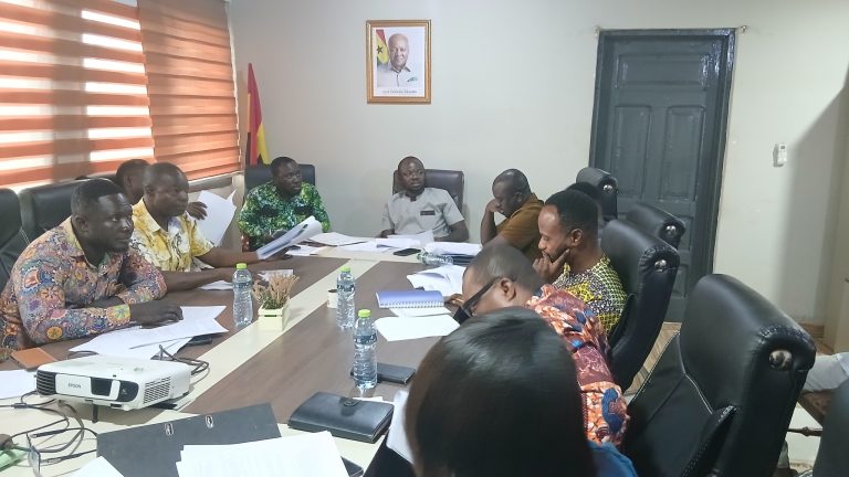 Hon. Alexander Adu-Quist, DCE, and members of the Executive Committee during deliberations at the DCE’s Office, where the Minutes of the previous meeting were reviewed and approved.